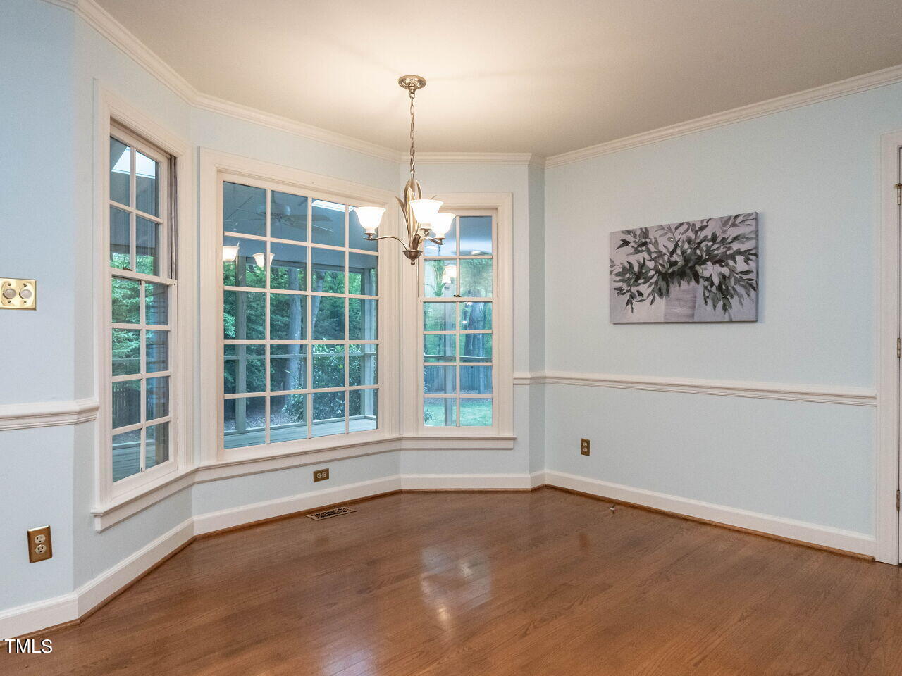 7805 Highlandview Circle Raleigh, NC 27613 - Photo 15 of 33 a view of an empty room with a window and wooden floor
