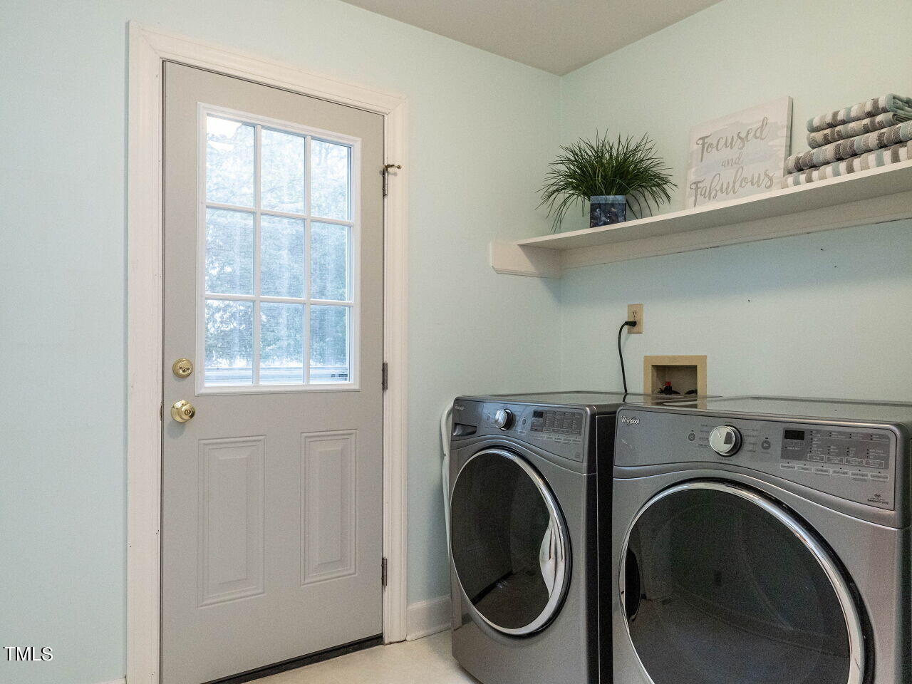 7805 Highlandview Circle Raleigh, NC 27613 - Photo 16 of 33 a utility room with dryer and washer