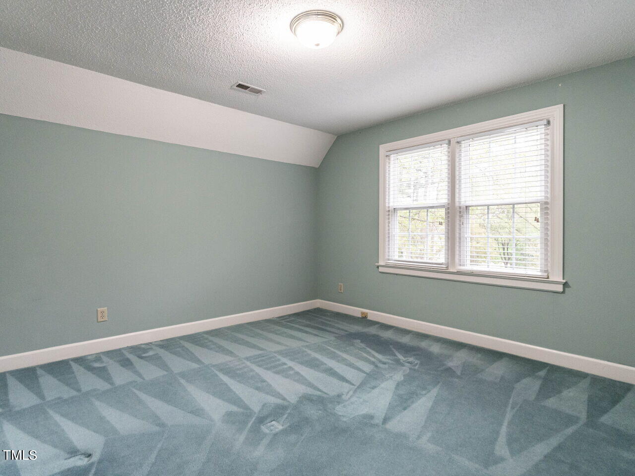 7805 Highlandview Circle Raleigh, NC 27613 - Photo 19 of 33 an empty room with a window