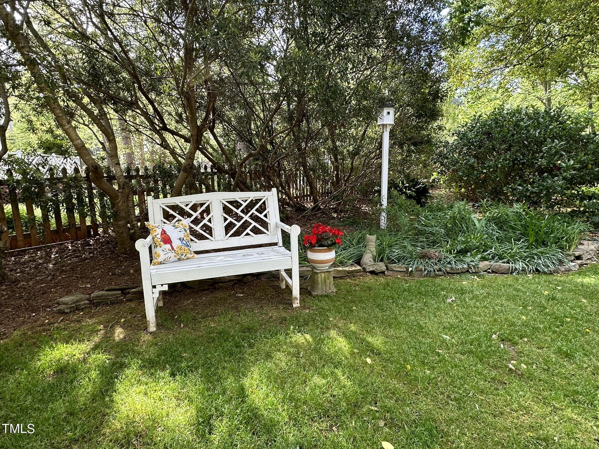 7805 Highlandview Circle Raleigh, NC 27613 - Photo 28 of 33 a white bench sitting in the middle of a park