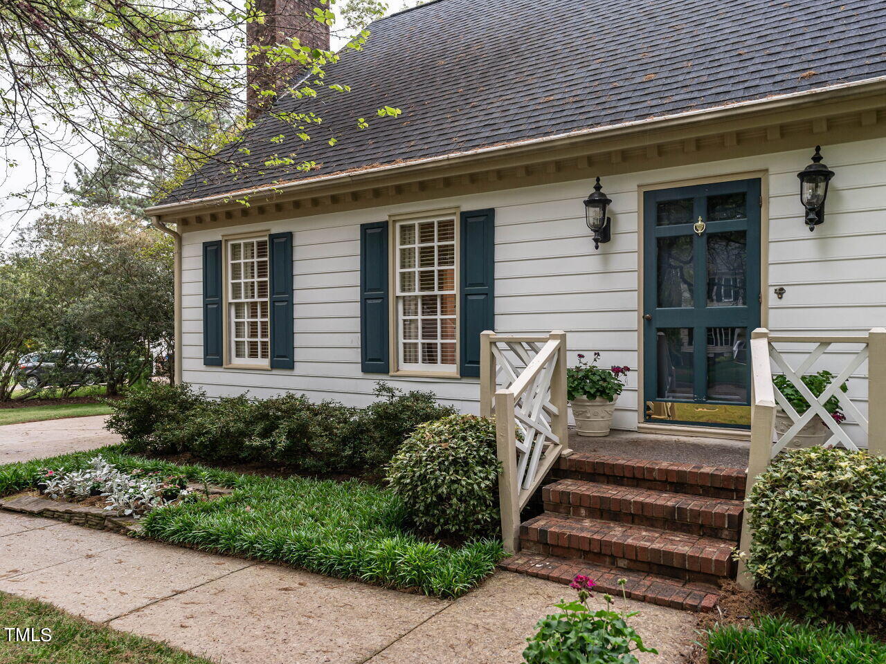 7805 Highlandview Circle Raleigh, NC 27613 - Photo 3 of 33 a front view of a house with a yard