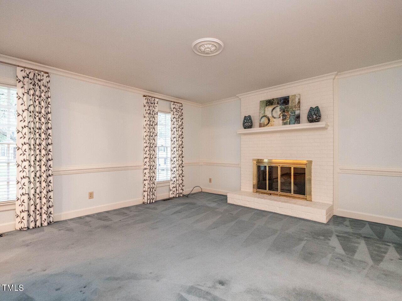 7805 Highlandview Circle Raleigh, NC 27613 - Photo 8 of 33 an empty room with windows