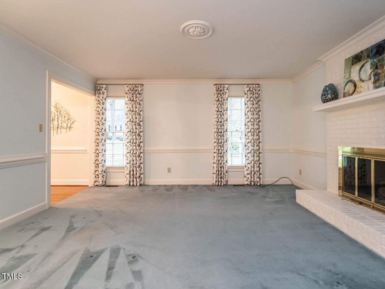 7805 Highlandview Circle Raleigh, NC 27613 - Photo 9 of 33 an empty room with windows