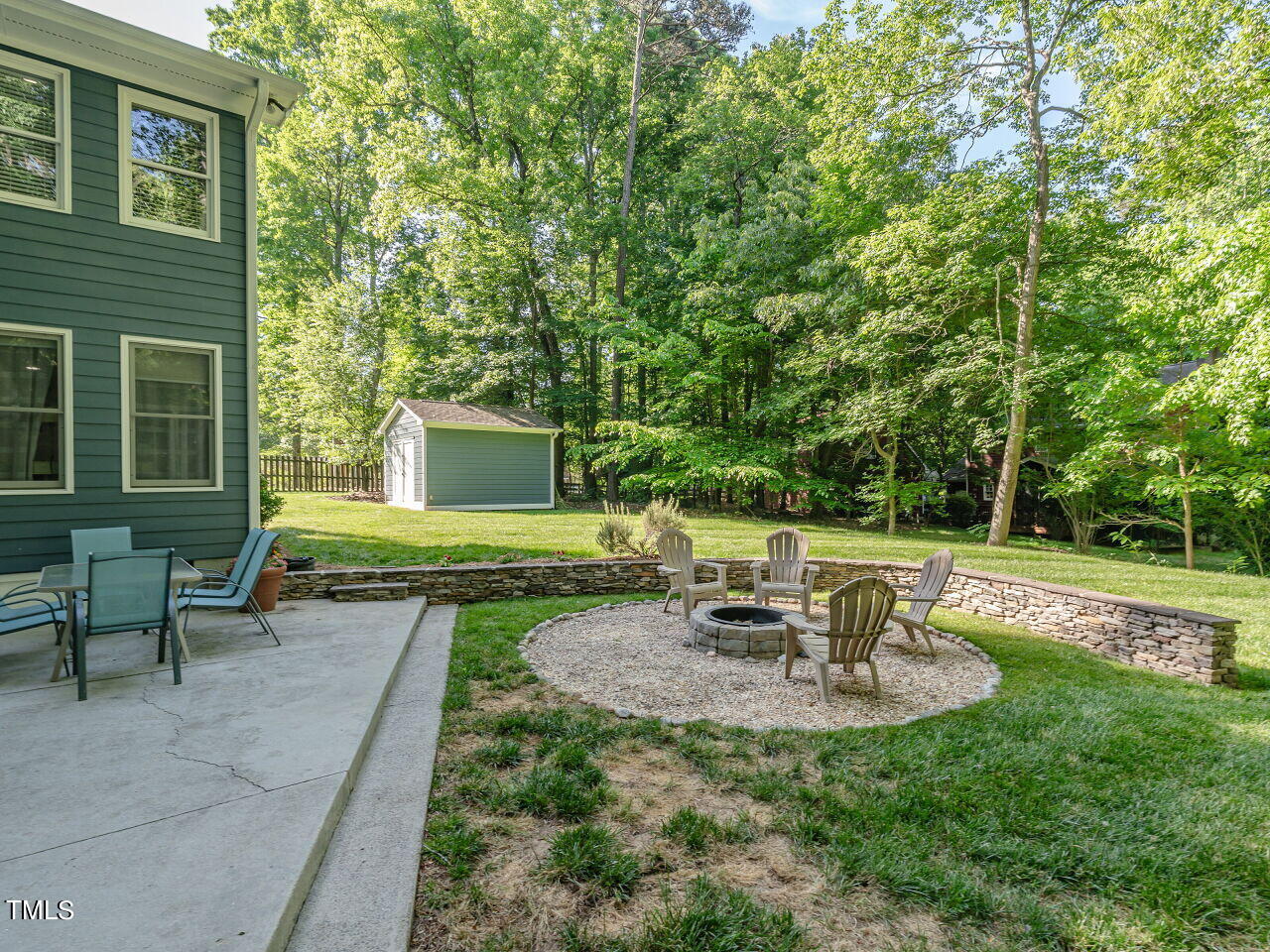 8313 North Creek Run Raleigh, NC 27613 - Photo 36 of 44 Additional patio and firepit for making smores and wonderful memories with family and friends.