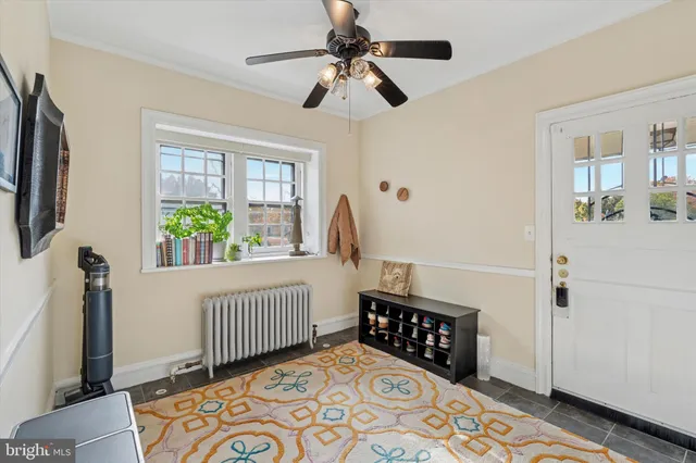 a bedroom with furniture and a window