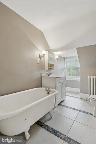 a bathroom with a bathtub and a sink