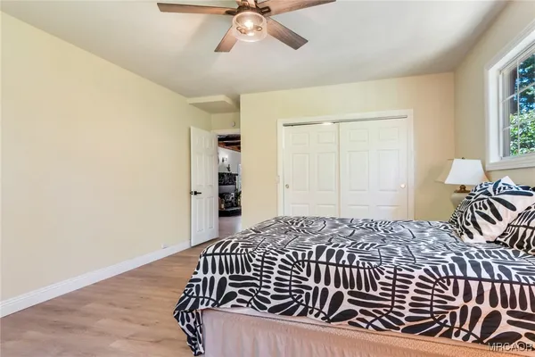 a bedroom with a bed and window