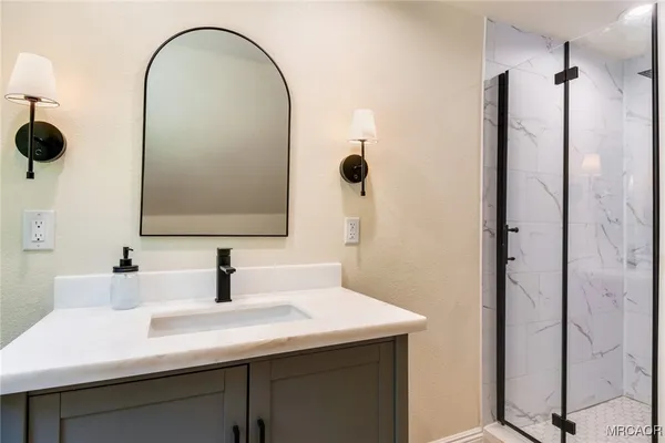 a bathroom with a sink and a mirror