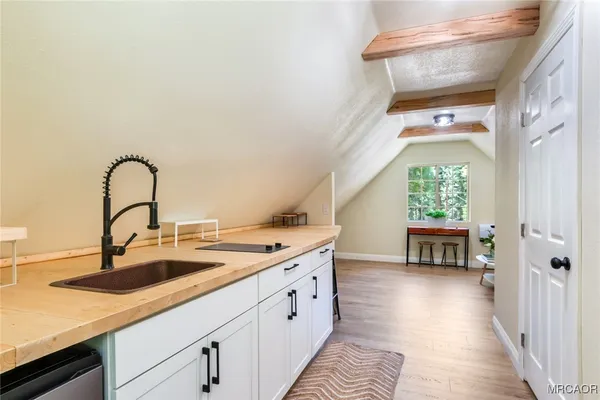 a kitchen with a sink and a window
