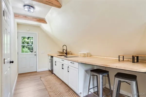 a kitchen with cabinets and sink