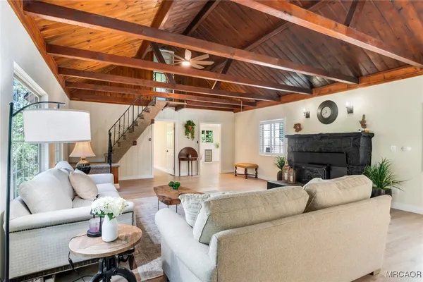 a living room with furniture and a clock