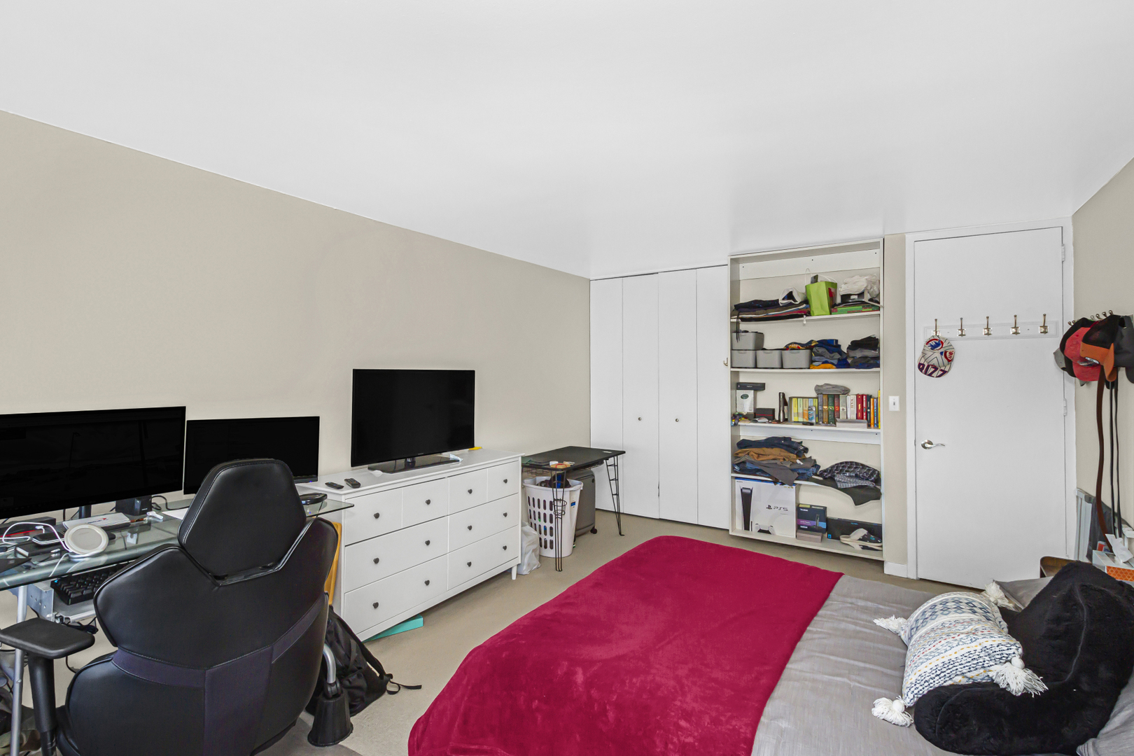 655 West Irving Park Road, Unit 2912 Chicago, IL 60613 - Photo 15 of 23 a bedroom with a bed and a flat screen tv