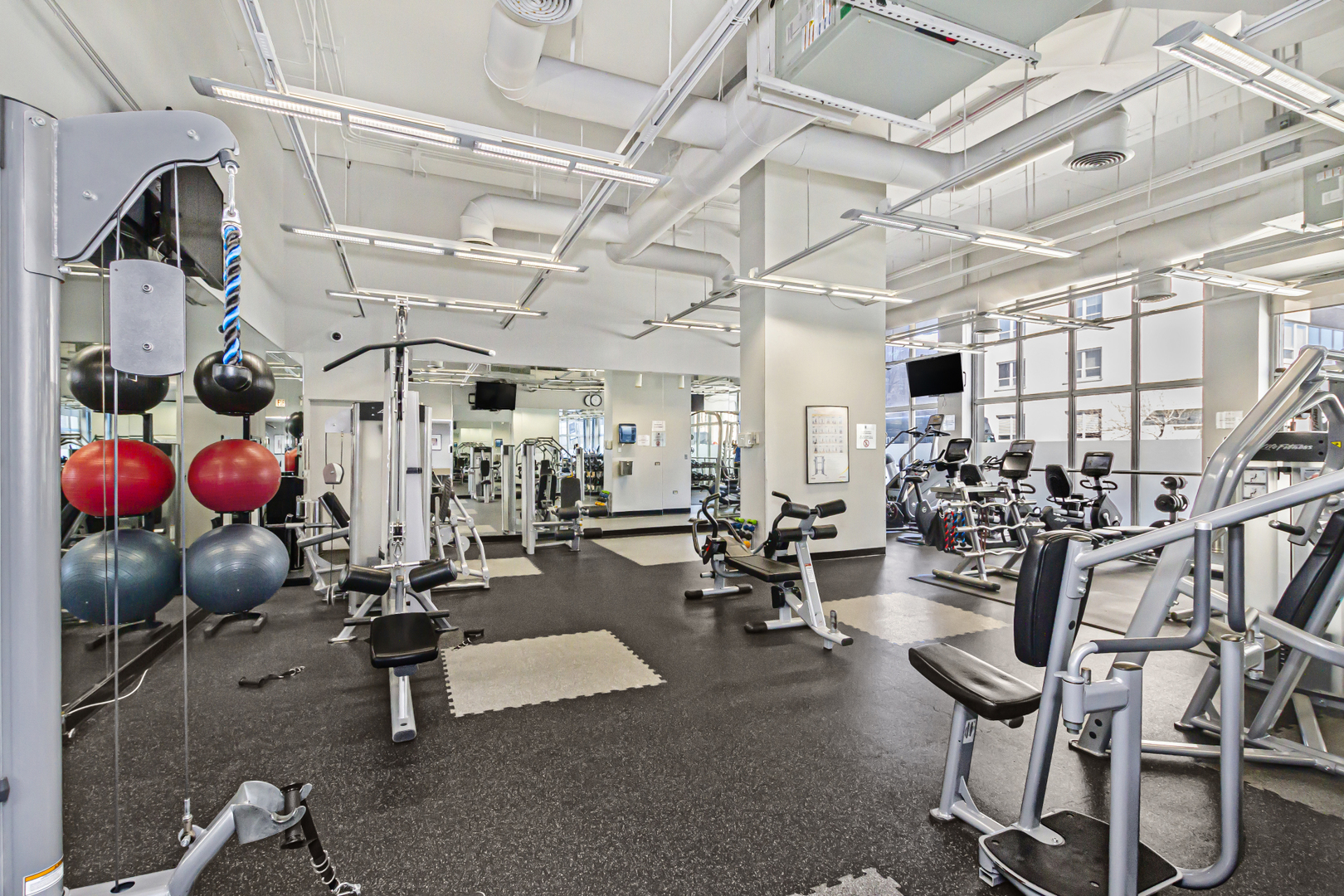 655 West Irving Park Road, Unit 2912 Chicago, IL 60613 - Photo 18 of 23 a view of a room with gym equipment
