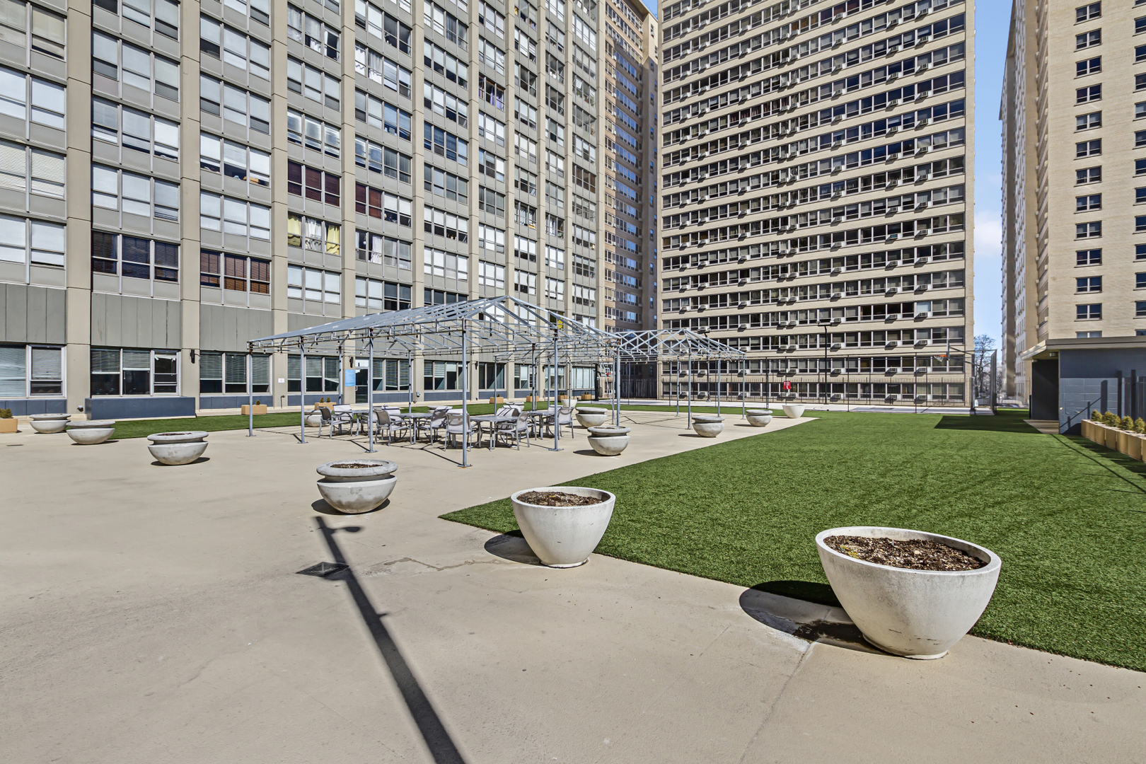 655 West Irving Park Road, Unit 2912 Chicago, IL 60613 - Photo 20 of 23 a view of a swimming pool and a yard