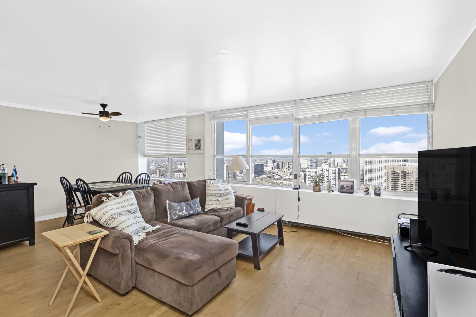 655 West Irving Park Road, Unit 2912 Chicago, IL 60613 - Photo 6 of 23 a living room with furniture and a flat screen tv