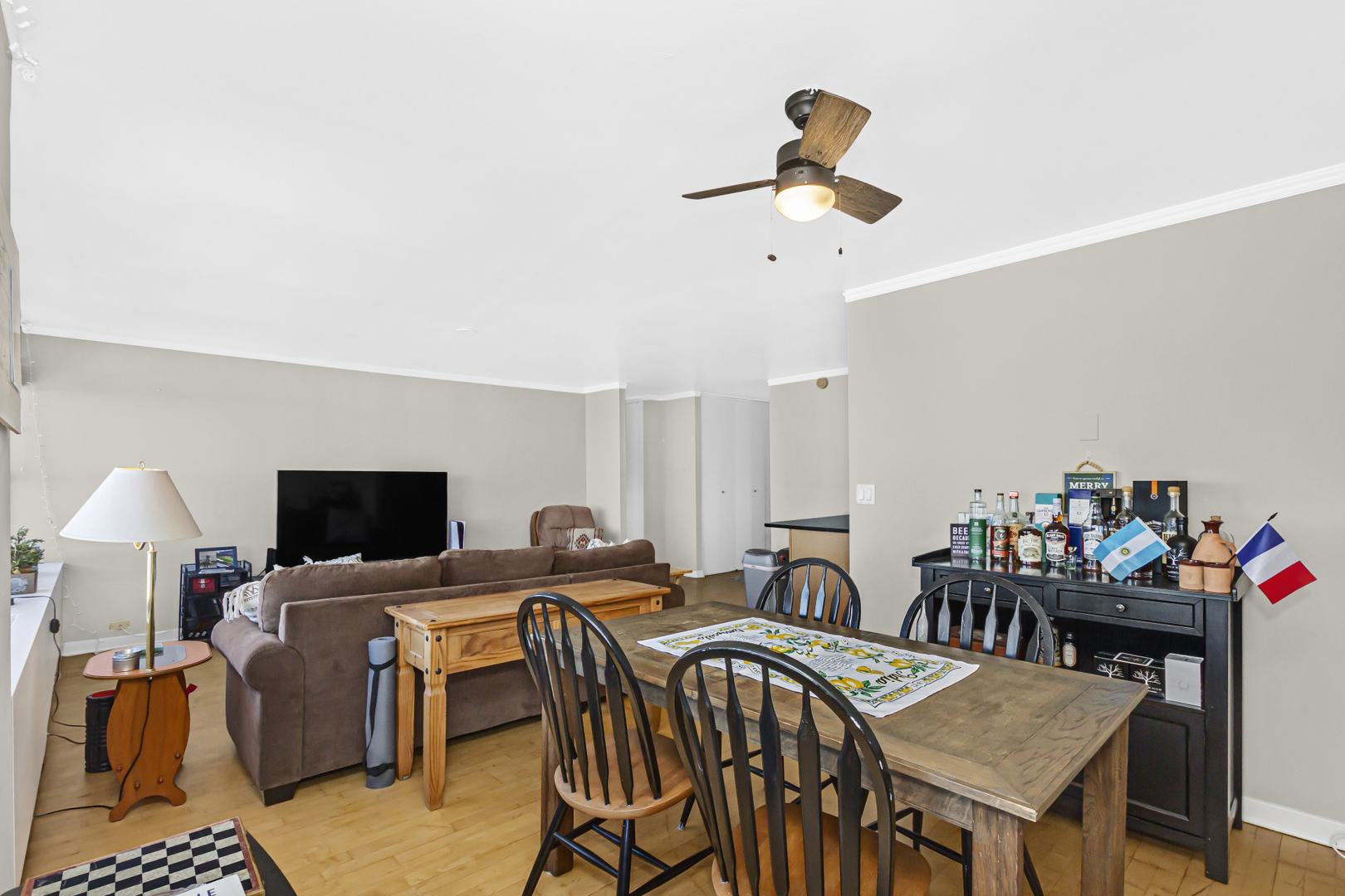 655 West Irving Park Road, Unit 2912 Chicago, IL 60613 - Photo 9 of 23 a living room with furniture and a flat screen tv