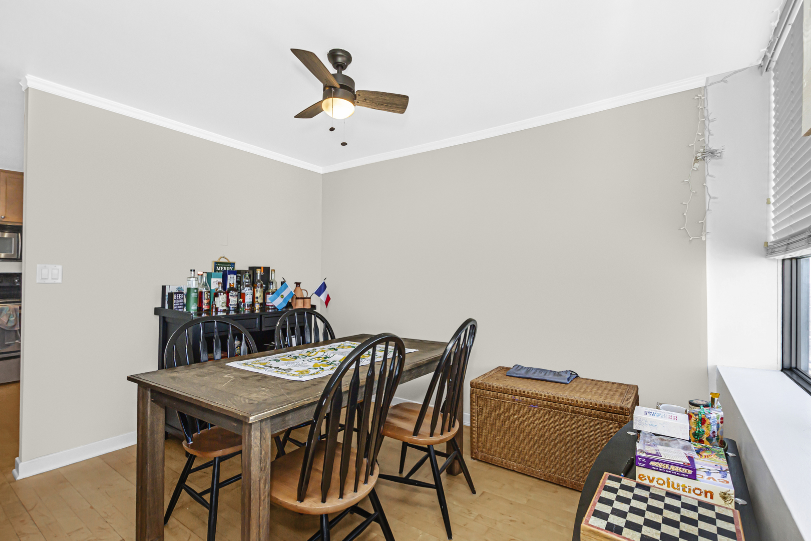 655 West Irving Park Road, Unit 2912 Chicago, IL 60613 - Photo 10 of 23 a view of a dining room with furniture and a chandelier