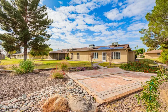 a view of a park with large trees