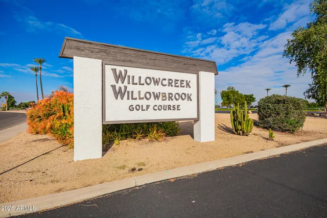 a view of a golf course with a lake view