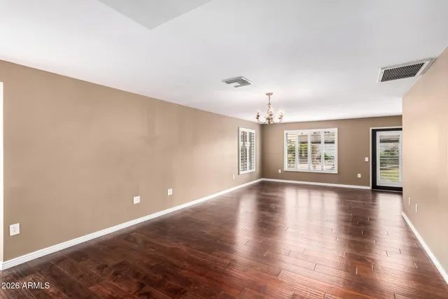 a kitchen with granite countertop a sink and cabinets
