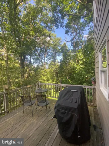 a view of balcony with furniture and trees