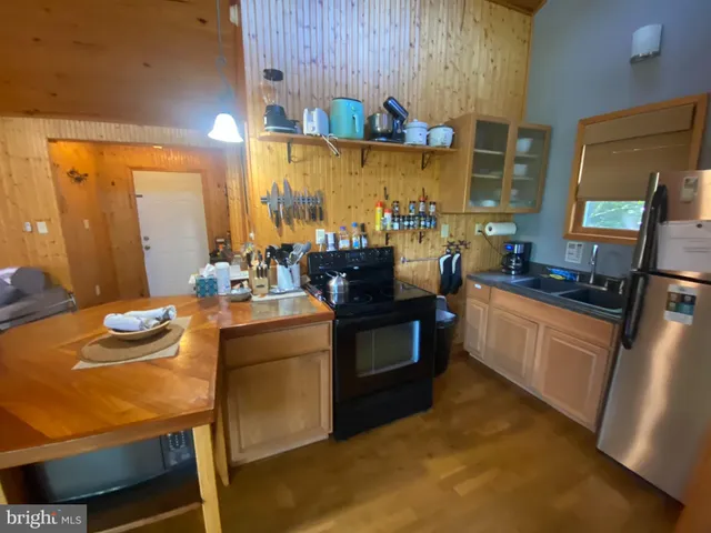 a kitchen with a stove and a refrigerator