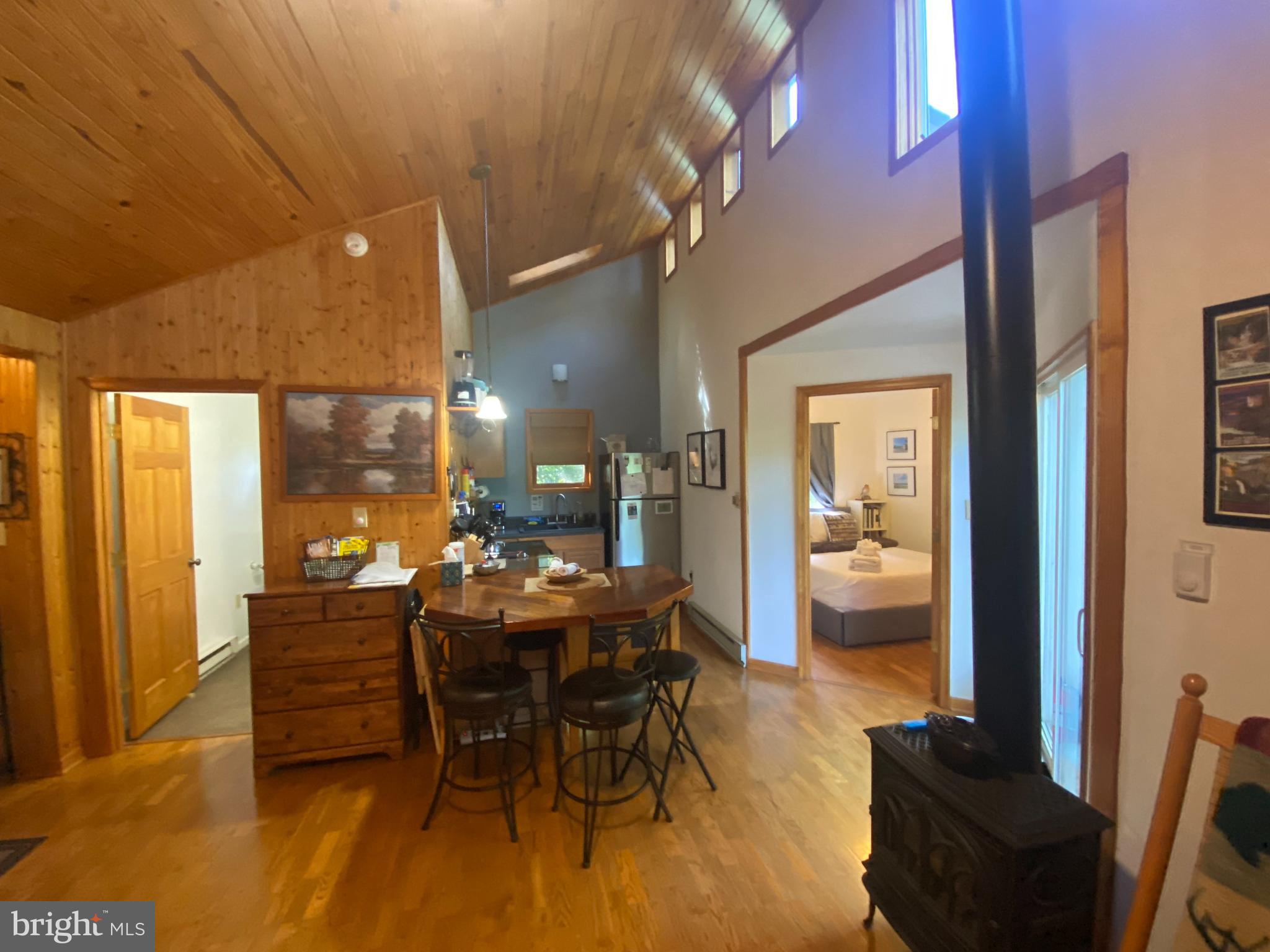568 Cliff Heights Road Stanley, VA 22851 - Photo 8 of 23 a dining room with furniture and a floor to ceiling window