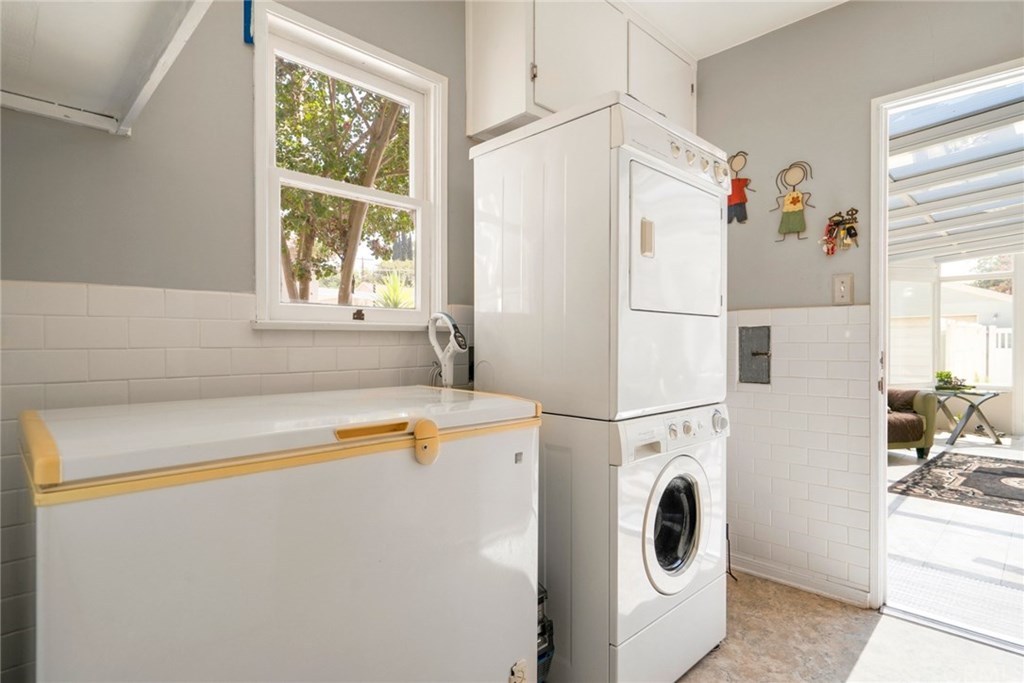 4682 Sunnyside Drive Riverside, CA 92506 - Photo 13 of 35 Laundry room with space for freezer, stackable units (which stay) and also a utility sink.