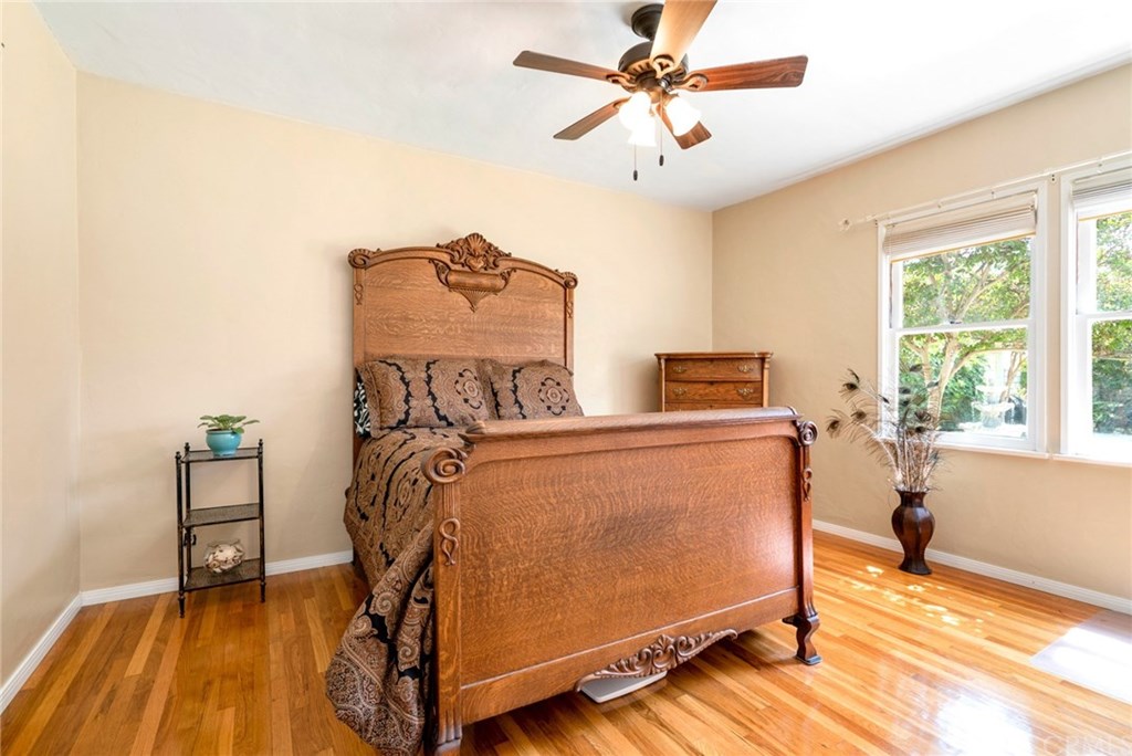 4682 Sunnyside Drive Riverside, CA 92506 - Photo 22 of 35 Bedroom #2 overlooking the back yard, complete with exposed hardwood floors, ceiling fan, and lots of natural light.