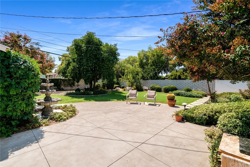 4682 Sunnyside Drive Riverside, CA 92506 - Photo 29 of 35 Quarter acre lot with extensive hardscape, landscape lights, tree up-lights, fountain, mature trees, auto irrigation, mow curbs, block wall, and the following fruit trees: lemon, orange, peach, and grapefruit.