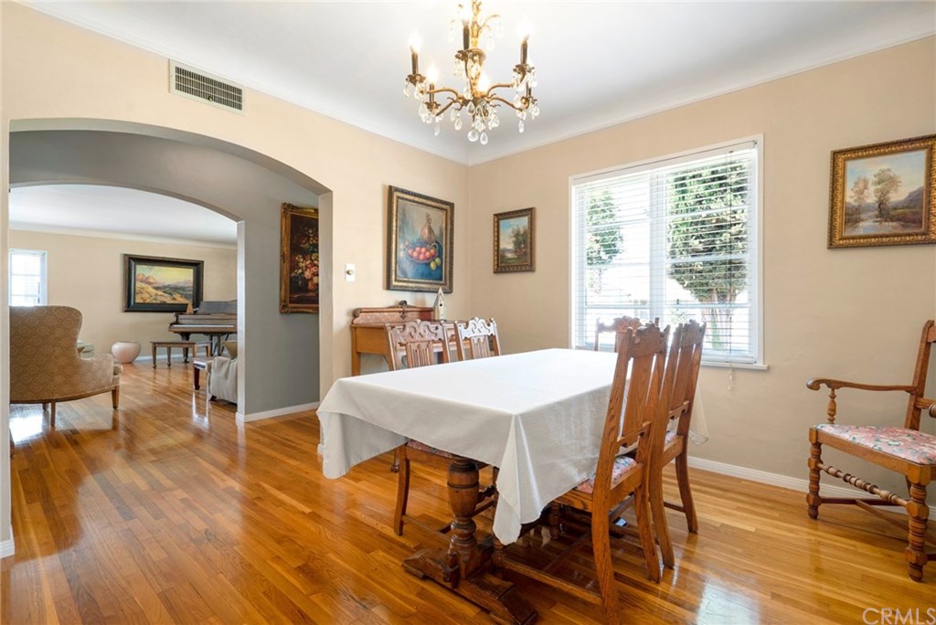 Formal dining room with view into the living room.