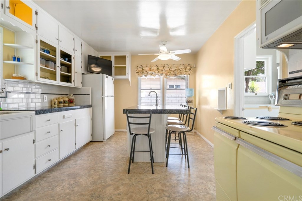 4682 Sunnyside Drive Riverside, CA 92506 - Photo 9 of 35 Quite spacious kitchen and island with sink and dishwasher.