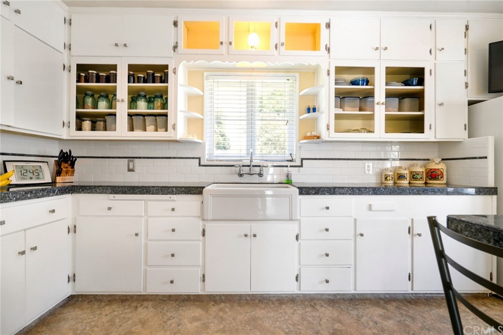 4682 Sunnyside Drive Riverside, CA 92506 - Photo 10 of 35 Original cabinetry and lots of it...with glass-fronted cabinets. Super charming!