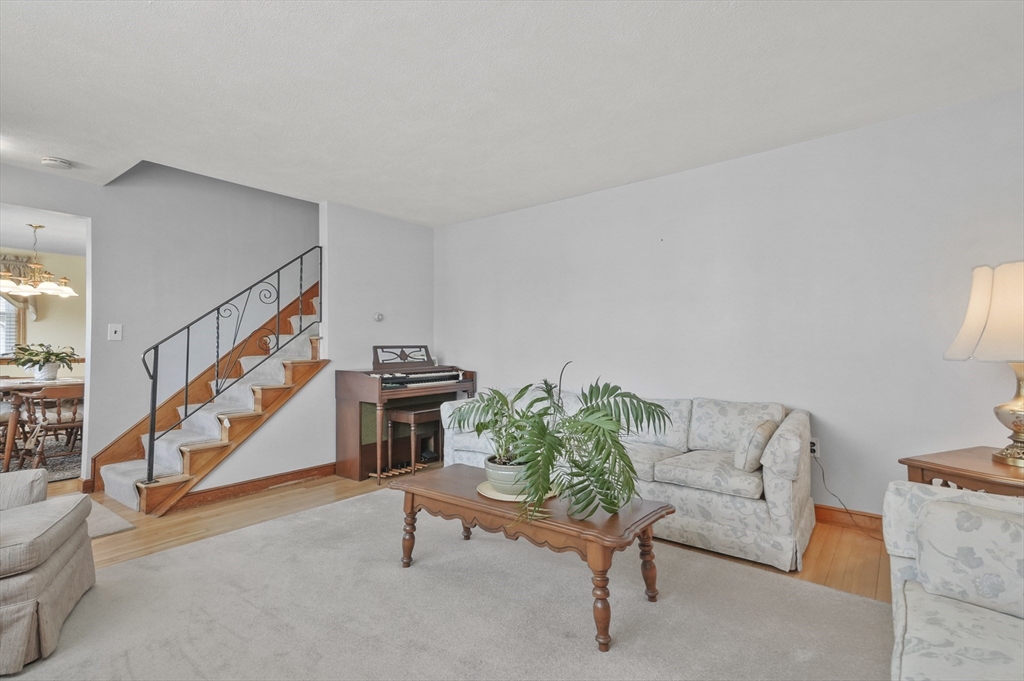 95 Gregory Street Waltham, MA 02451 - Photo 15 of 36 a living room with furniture and a stairs