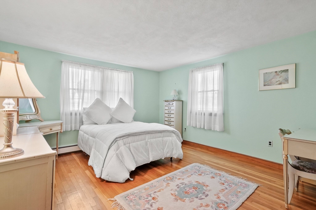 95 Gregory Street Waltham, MA 02451 - Photo 19 of 36 a bedroom with a large bed and a window