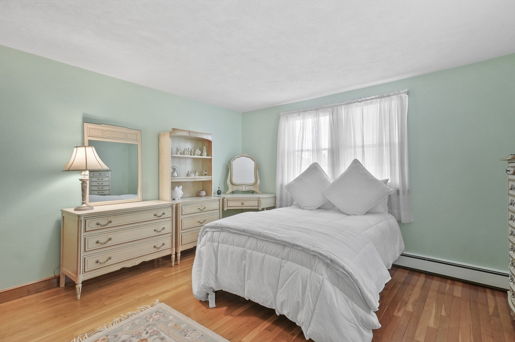 95 Gregory Street Waltham, MA 02451 - Photo 20 of 36 a bedroom with a bed and a dresser