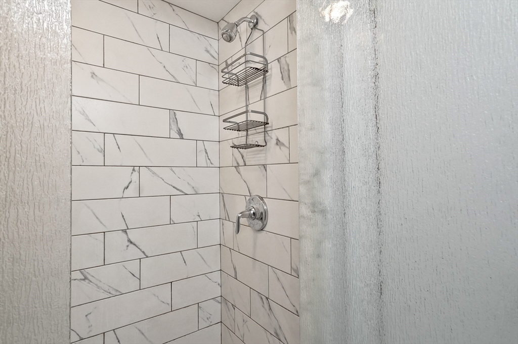 95 Gregory Street Waltham, MA 02451 - Photo 28 of 36 a bathroom with a shower