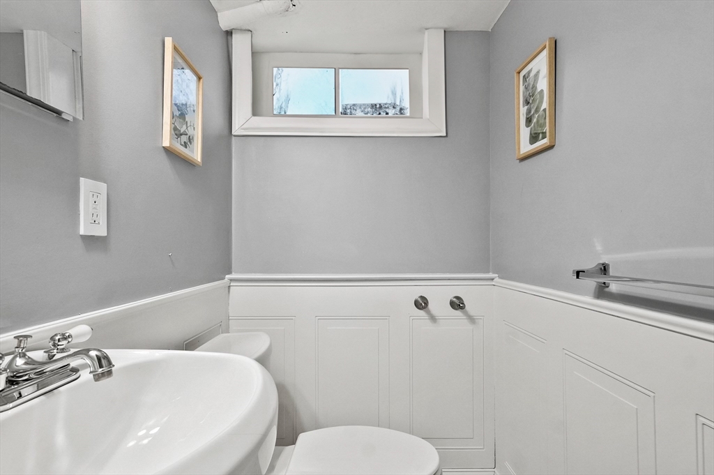 95 Gregory Street Waltham, MA 02451 - Photo 32 of 36 a bathroom with a bathtub and sink