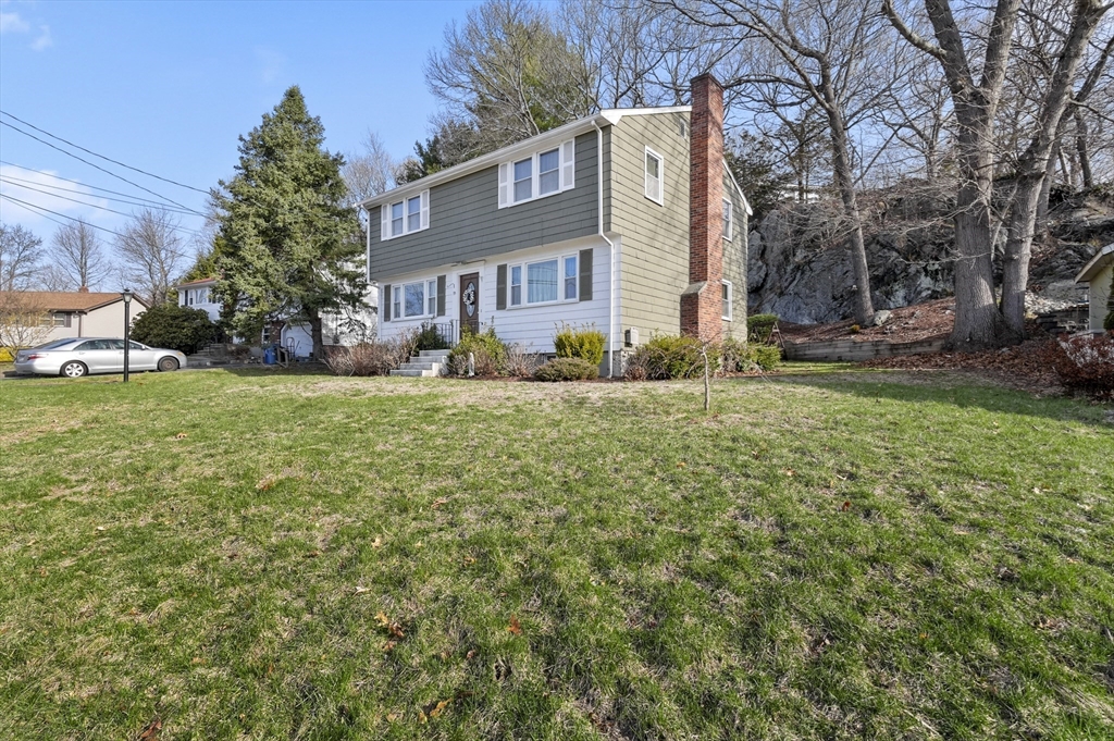 95 Gregory Street Waltham, MA 02451 - Photo 34 of 36 a view of a house with a yard