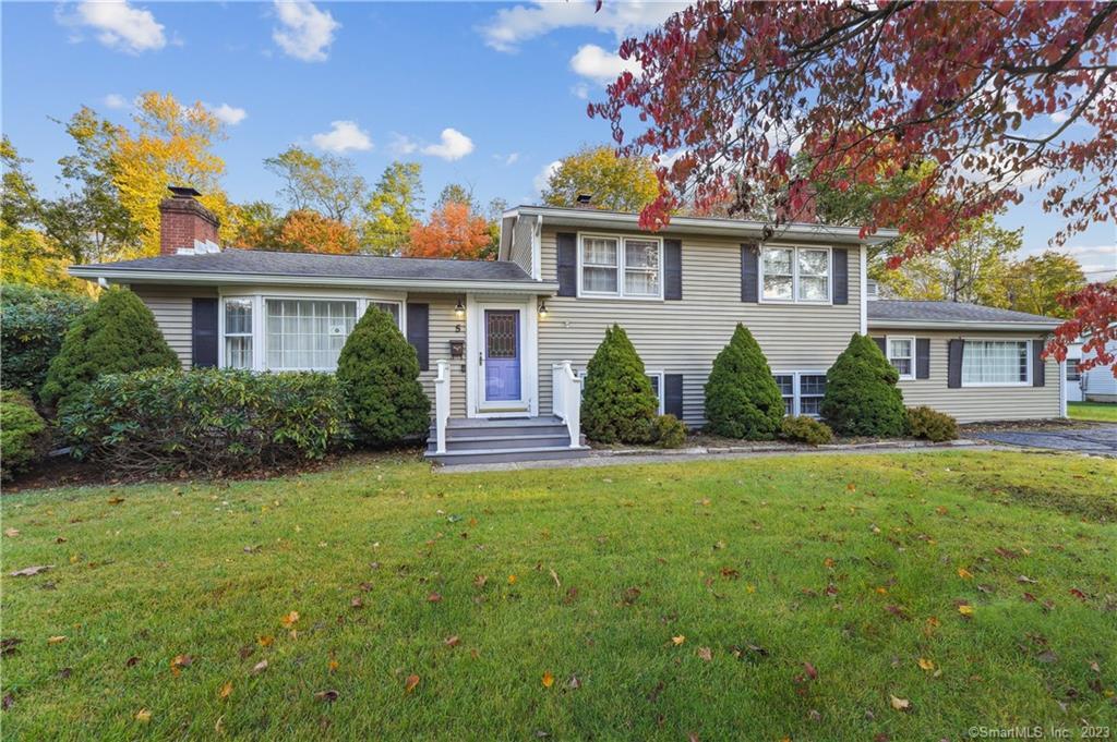 front view of a house with a yard