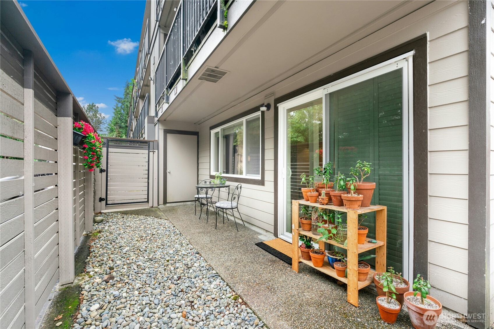 9523 Northeast 180th Street, Unit A102 Bothell, WA 98011 - Photo 24 of 29 a balcony view with a outdoor seating space