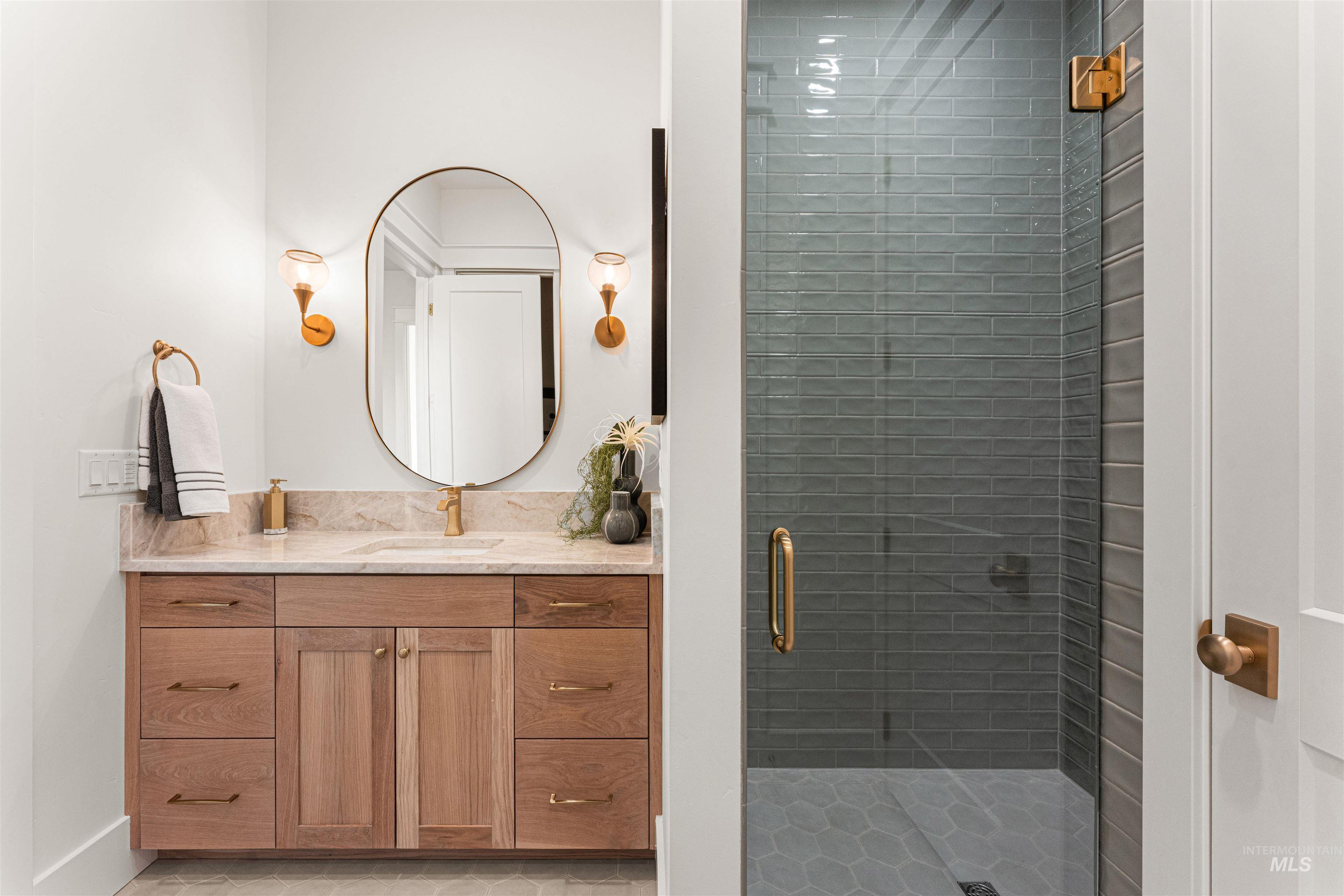 6400 North High Vly Way Eagle, ID 83714 - Photo 18 of 49 Bathroom featuring vanity, a stall shower, and light tile patterned floors