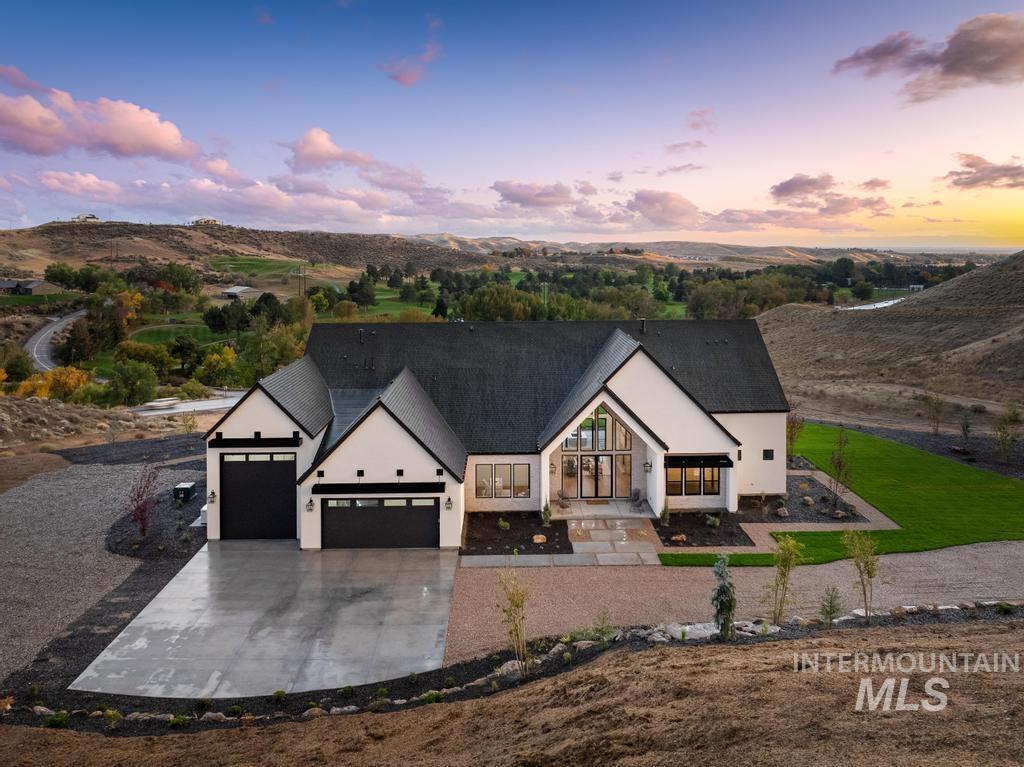 6400 North High Vly Way Eagle, ID 83714 - Photo 2 of 49 Modern inspired farmhouse with a garage and driveway