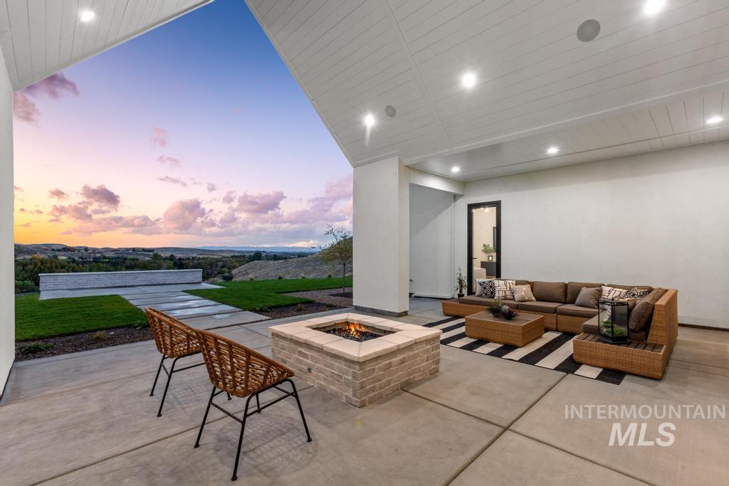 6400 North High Vly Way Eagle, ID 83714 - Photo 43 of 49 Patio terrace at dusk with a patio and an outdoor living space with a fire pit