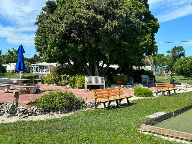 an outdoor sitting area with chairs