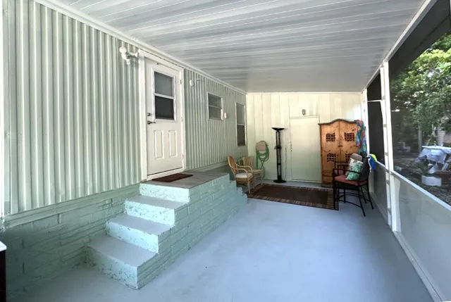 a view of a hallway with seating space