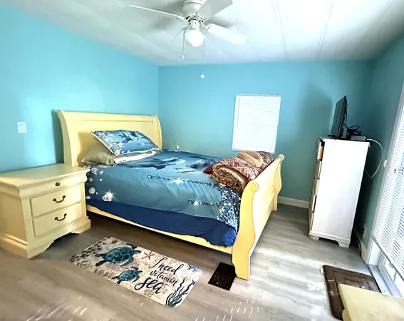 a bed room with a bed and a television