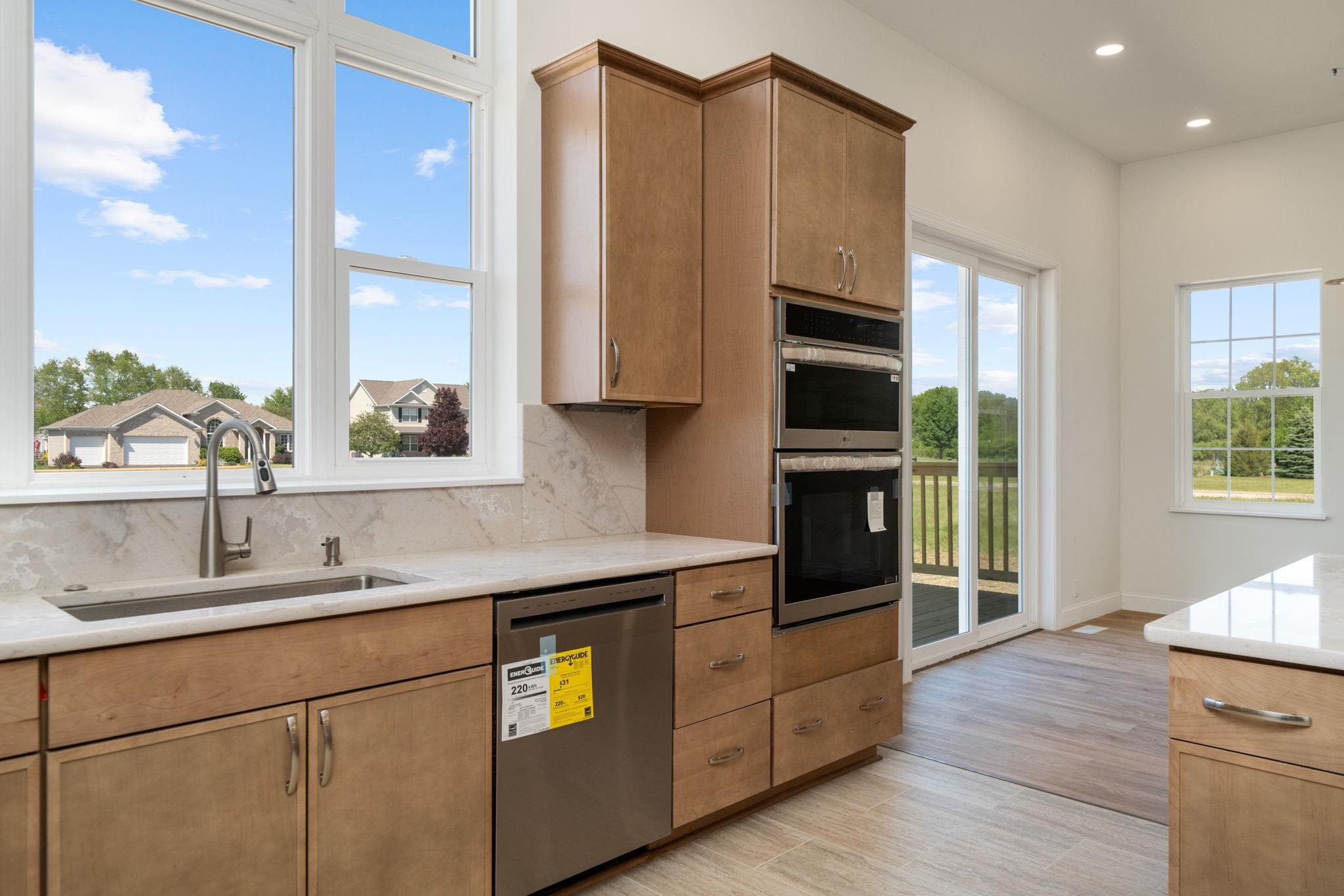 5145 Sycamore Ridge Road Belvidere, IL 61008 - Photo 16 of 57 a kitchen with stainless steel appliances a stove sink and cabinets
