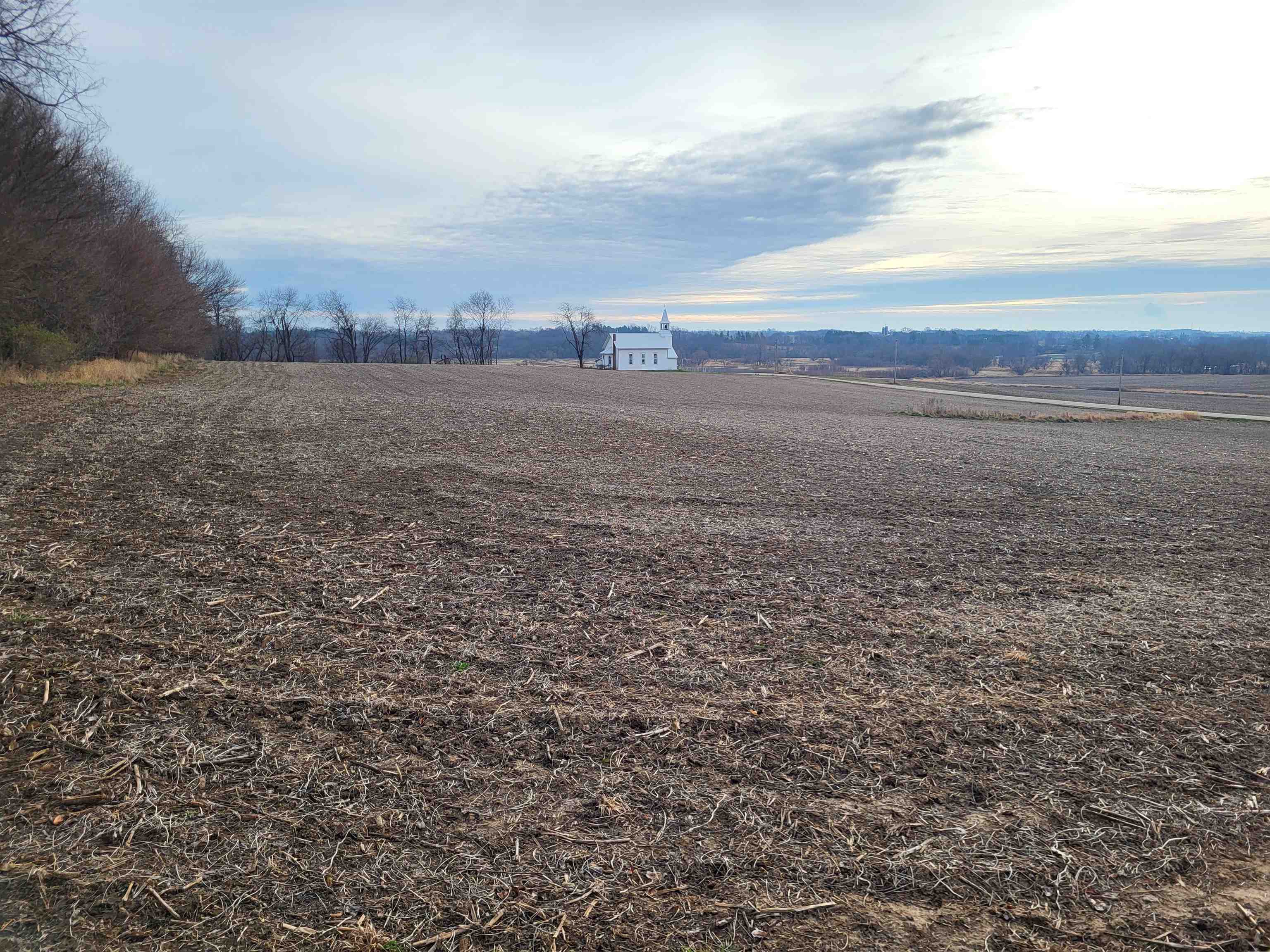 a view of an ocean beach and city