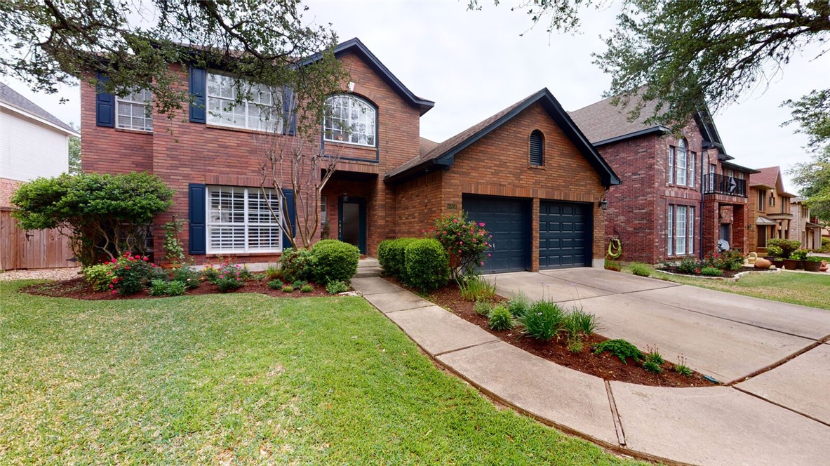10804 Redmond Road Austin, TX 78739 - Photo 1 of 1 a front view of a house with yard and green space